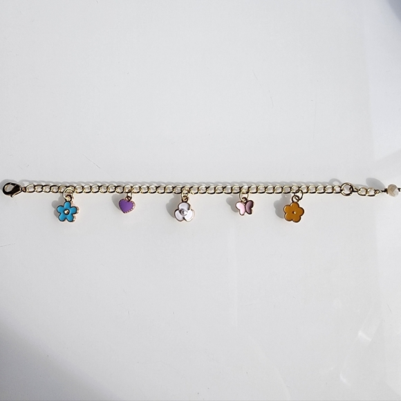 Charm bracelet. 6 inches with 1 inch extender. Gold w/ colorful charms. - Picture 5 of 5